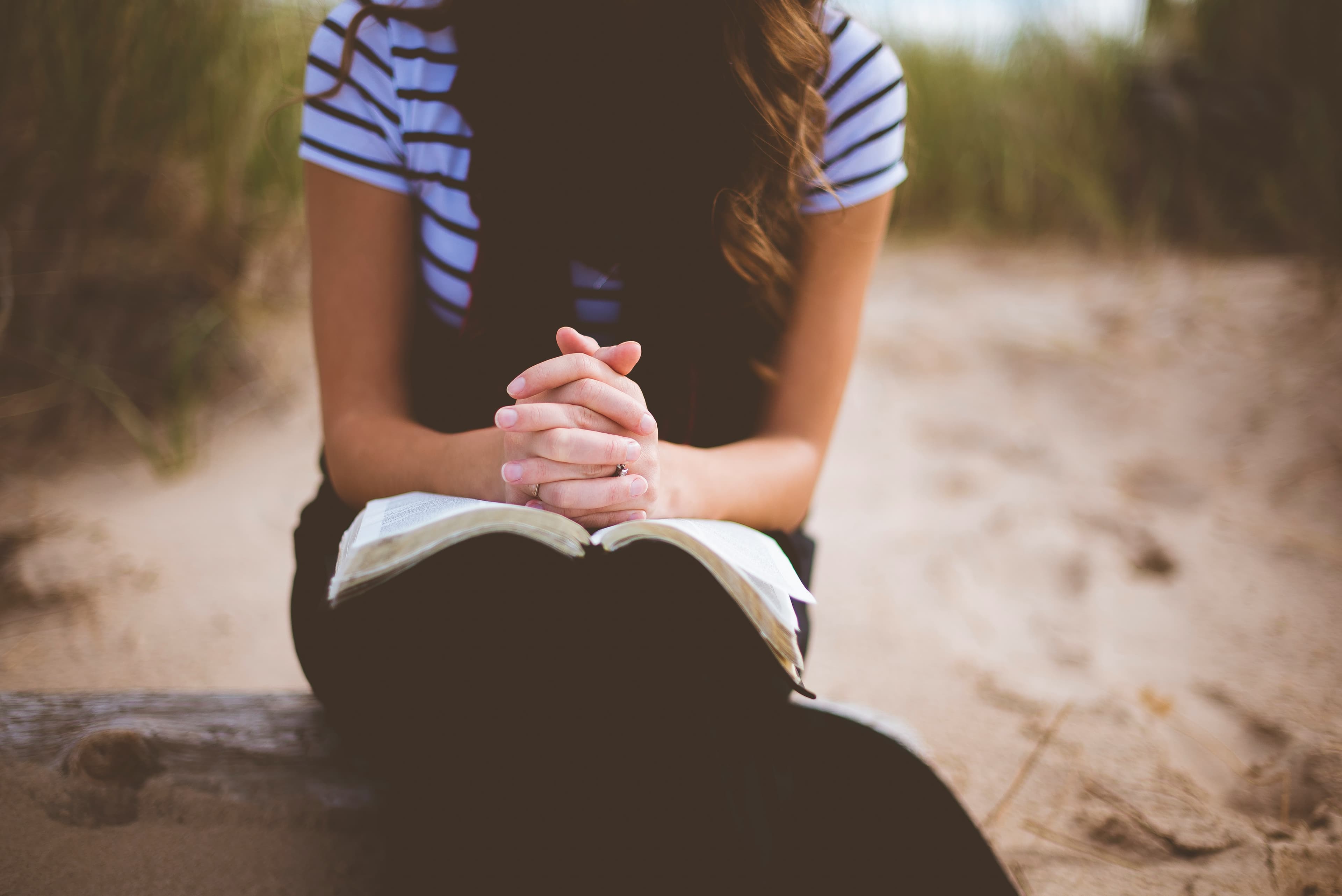 A woman reading in quiet reflection, representing the 19th Annotation retreat in everyday life